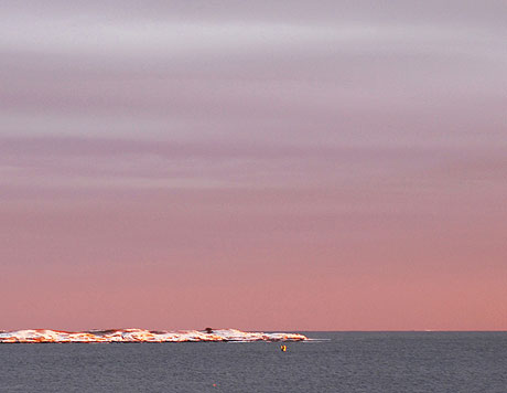 Pink skies over island